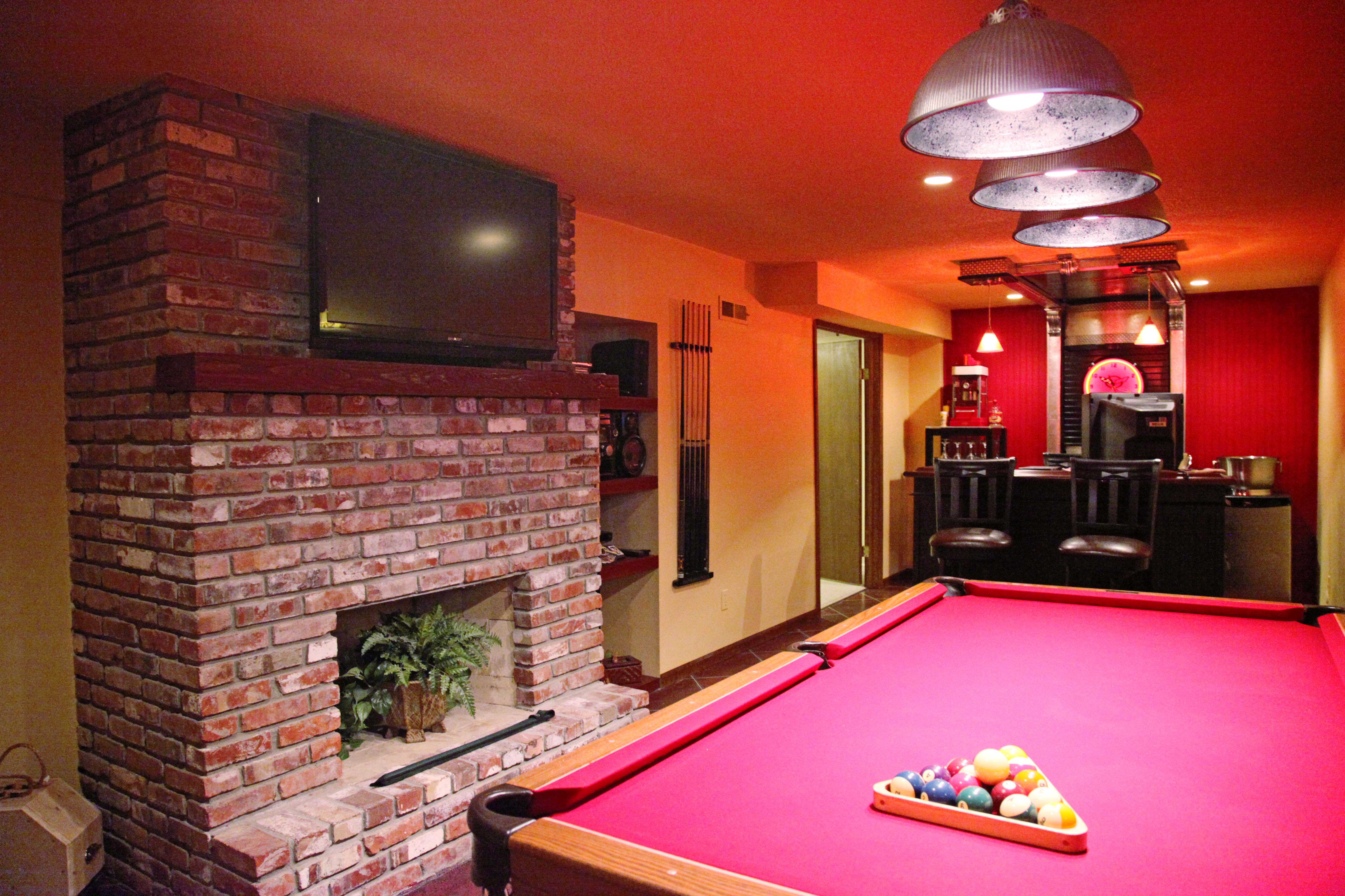 Red Yellow Black Mural Painted Basement Man Cave with Pool Table TV