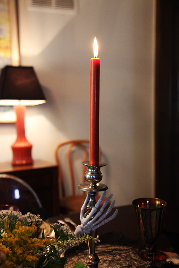 Red taper candles on a Halloween table