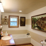 Organized Master Bath Linen Closet with Labels Door that Says Linens